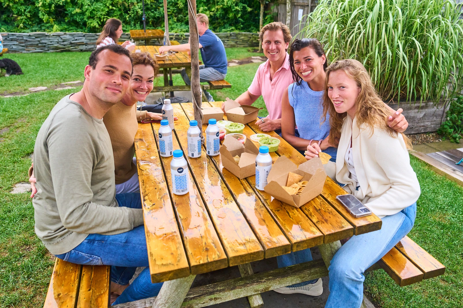 Family and friends gathered for lunch outside in Nantucket